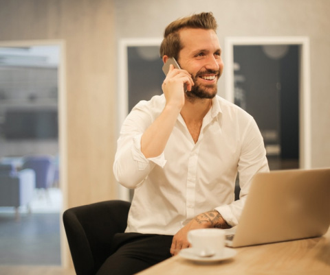 Young man using laptop in office