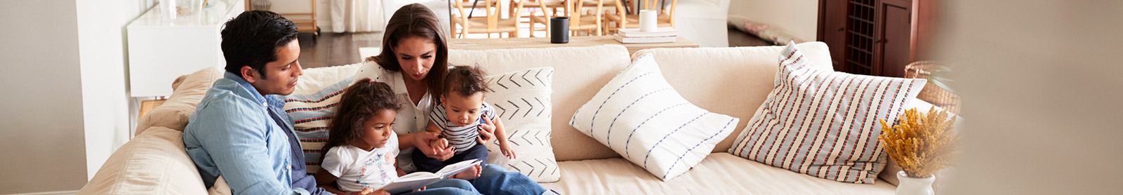 Young family sitting in living room