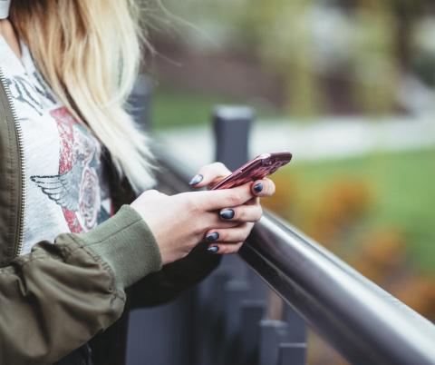 Close up of woman using cell phone